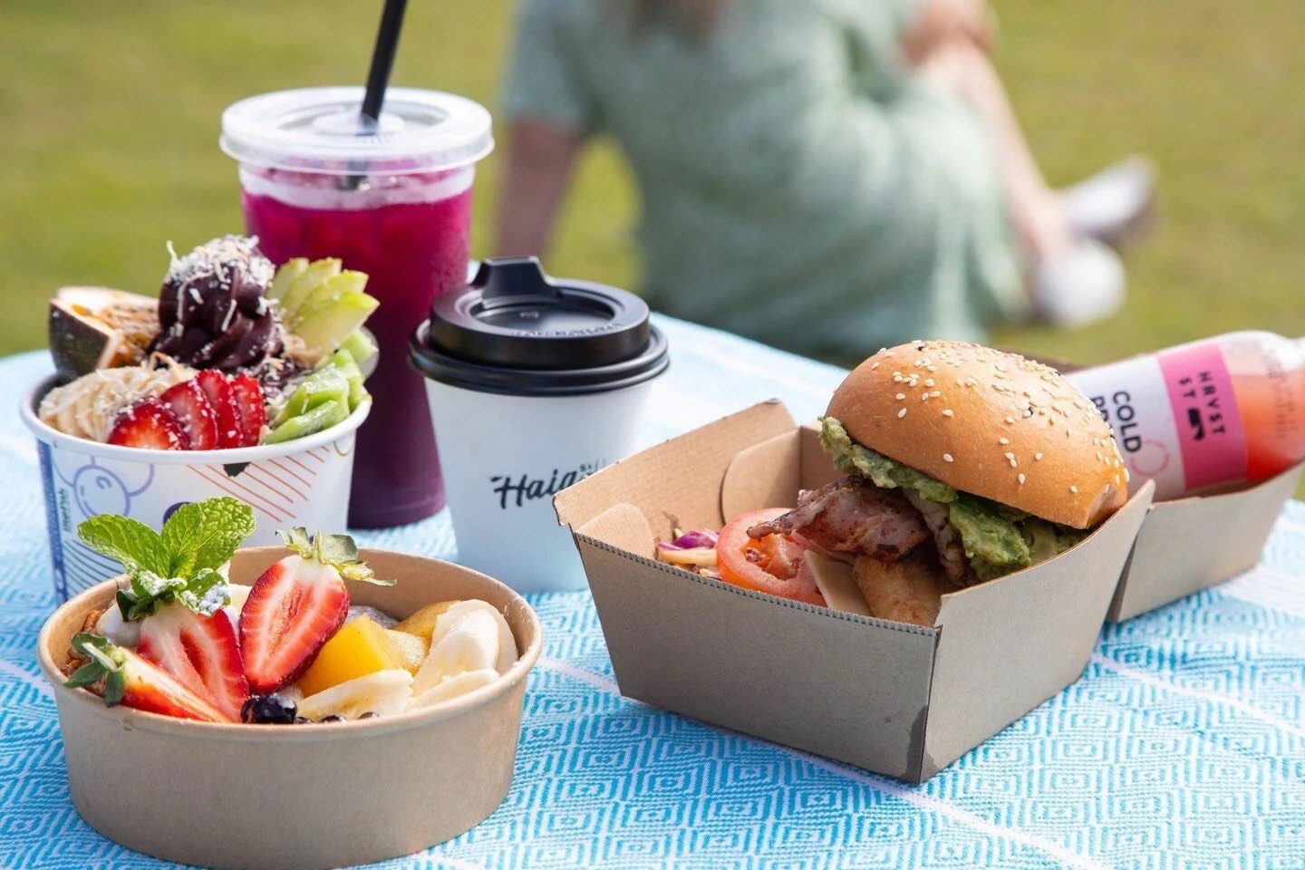 Haig St Catering picnic spread with burgers, acai bowls, fresh juice and coffee