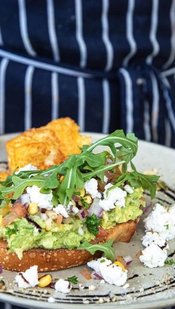 Smashed avocado on sourdough with fetta, dukkah and rocket at Haig St Cafe Kirra